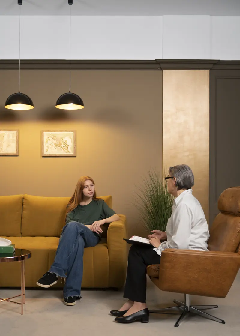 Young person undergoing psychological therapy in a comfortable affirming space